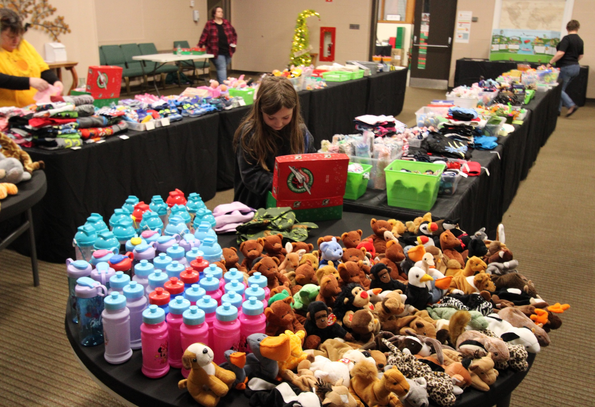 Gift and care items arranged for children and families