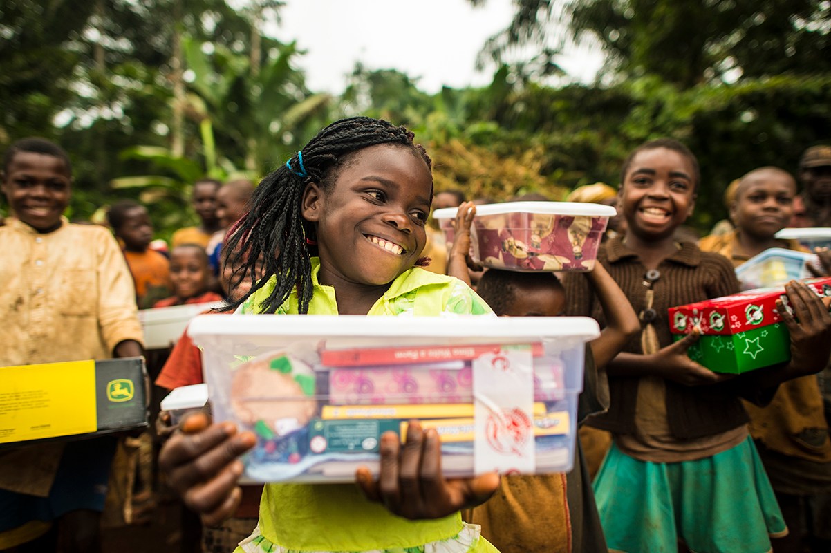 Community outreach volunteers distributing care packages to children and families in Brampton